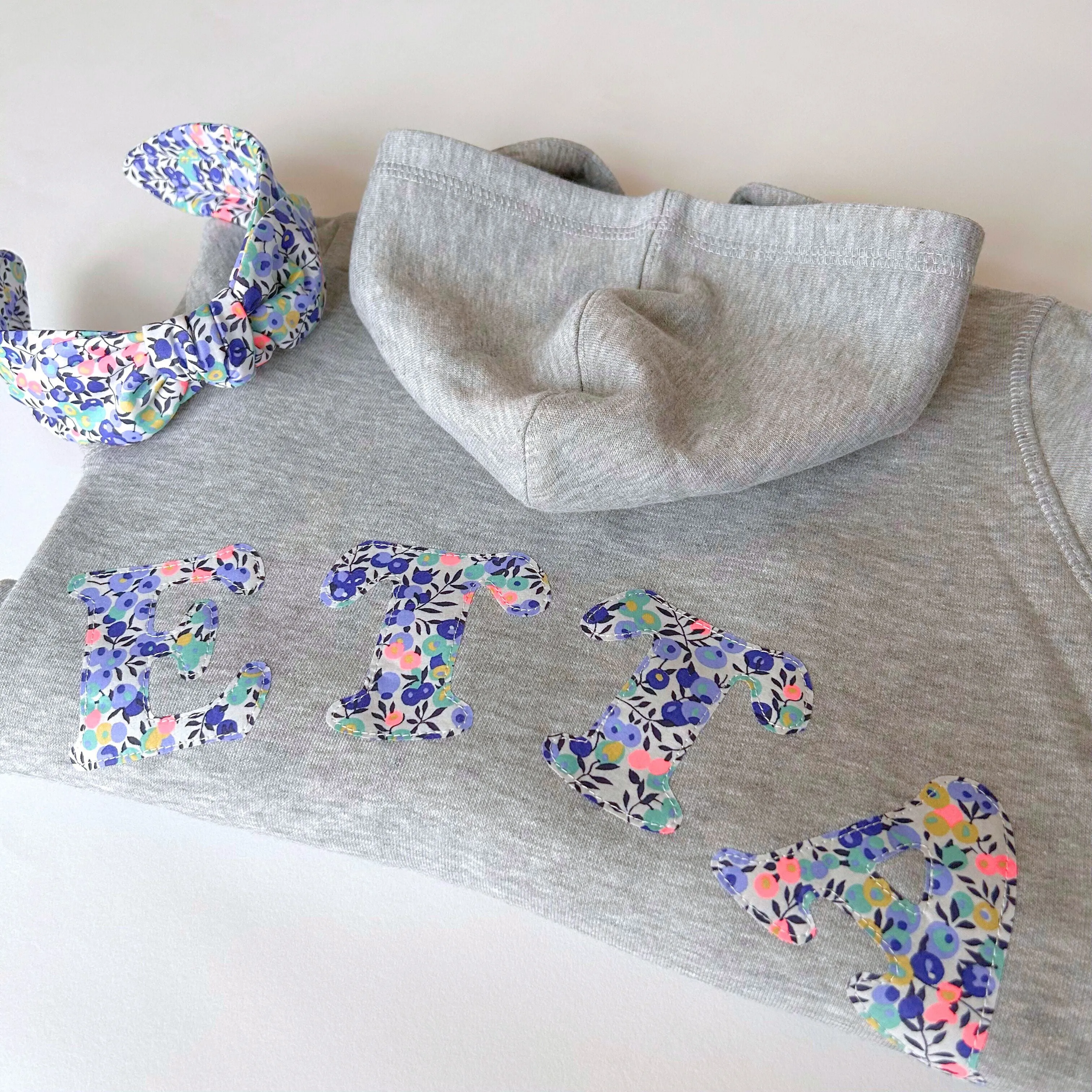 Name onesie with elbow patches