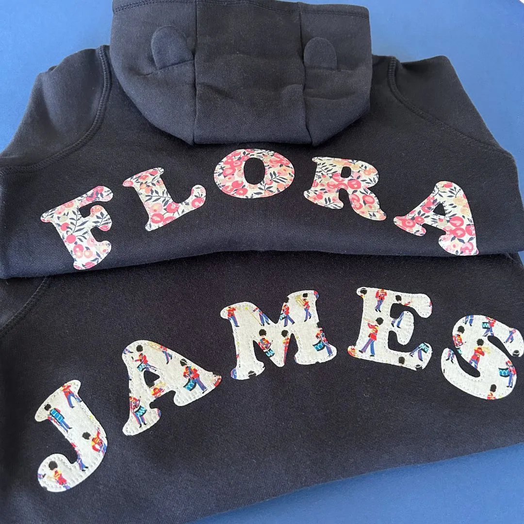 Name onesie with elbow patches